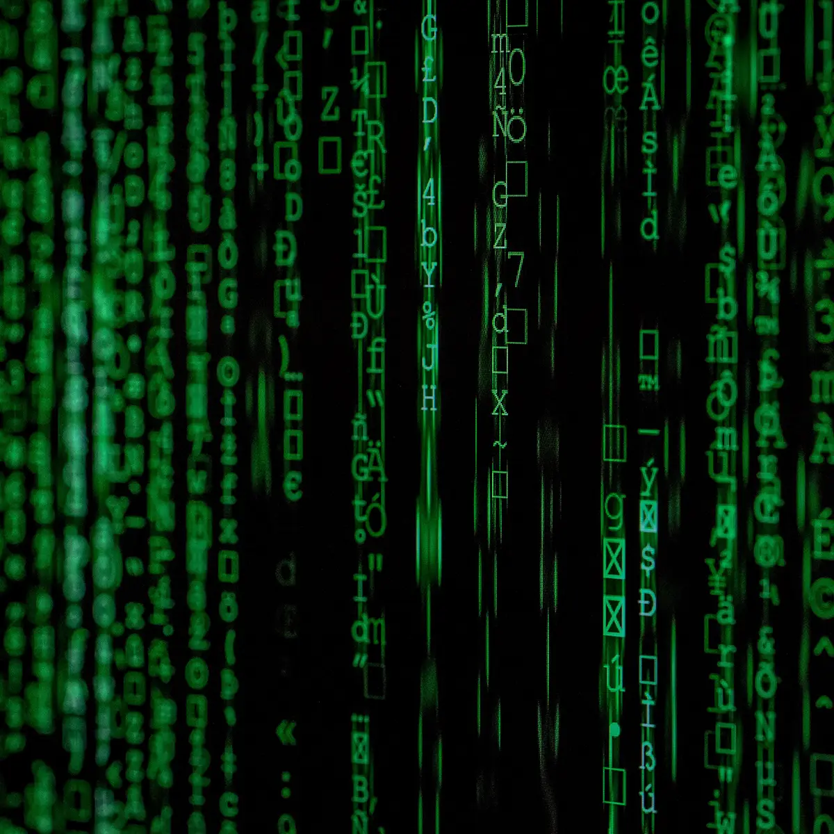 green strings of text on black background